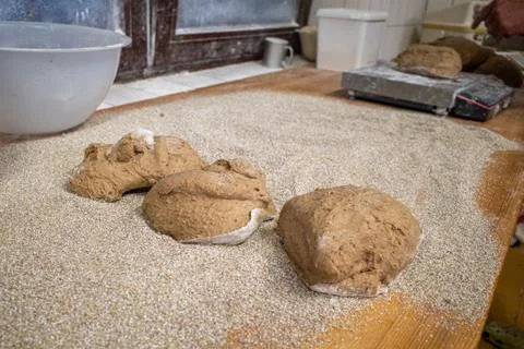 In bakery the loaves of bread lie side by side on the table Stock Photos