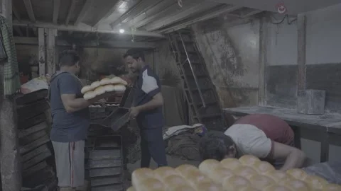 A bakery that produces bread and its workers in Mumbai, India Stock Footage 345390248