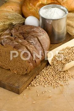 Bakery Products And Grain On Wood