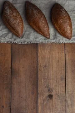 Bakery rustic crusty loaves of bread on wooden background Stock Photos