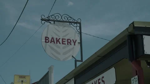 Bakery Sign Hanging Above Stall at Eumundi Markets, Sunshine Coast, Australia Stock Footage 341294792