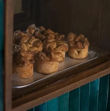 Bakery with sweet breads displayed in the window for you to take one Stock Photos