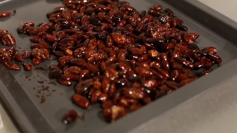 Bakery tray with roasted almonds in sugar Stock Footage 115285799