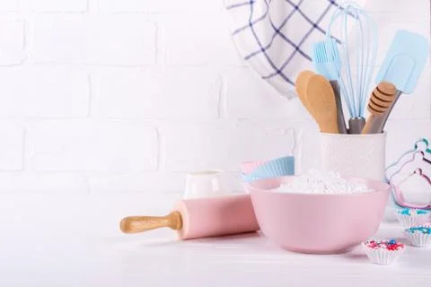Bakery utensils. Kitchen tools for baking on a white wooden background. Stock Photos