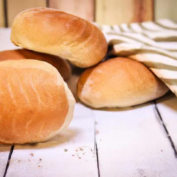 Bakery with various types of freshly baked bread. Buns, baguette, bagel, swee Stock Photos
