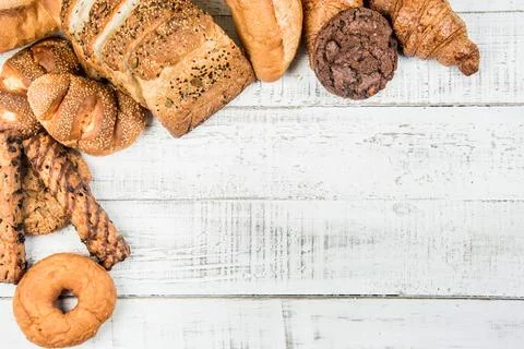 Bakery on wood white background different types of bread Foto stock