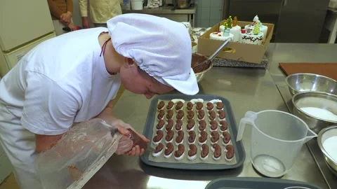 Bakery Worker Preparing Chocolate Confectionery on Baking Tray Stock-Footage 345046535