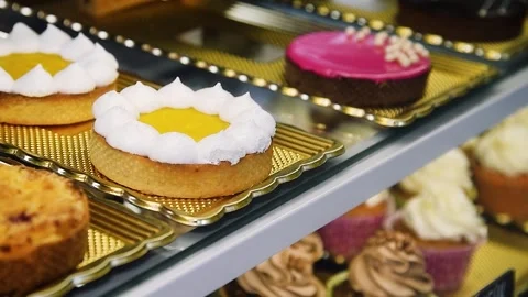 Bakery's assortment is displayed on the showcase Vídeo Stock 220617754
