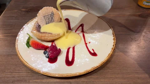 Bakewell pudding and custard Stock Footage 274842254