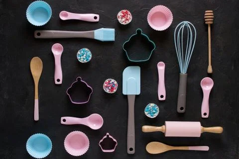 Baking and cooking concept. Pattern made of cookie cutters, whisk, roller pin Stock Photos