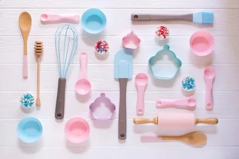 Baking and cooking concept. Pattern made of cookie cutters, whisk, roller pin Stock Photos