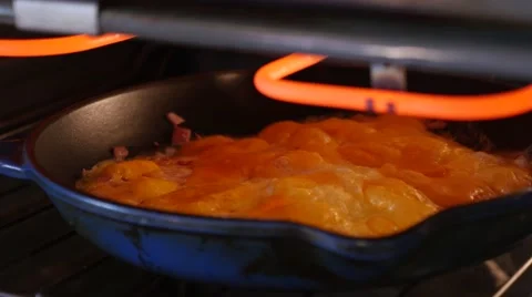 Baking and melting cheese on an omelette. Stock Footage 49923897