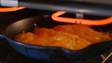 Baking and melting cheese on an omelette. Stock Footage 49923936