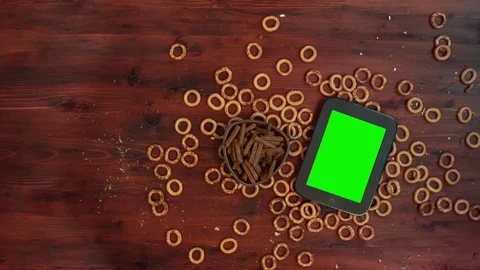 Baking and smartphone book with green screen on wood table. Stock Footage 84000415