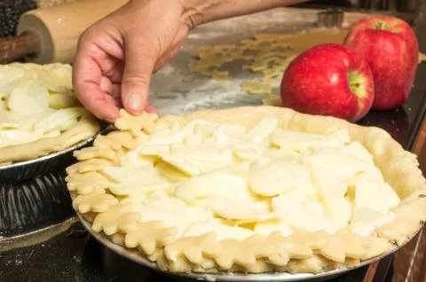 Baking an apple pie with apples Stock Photos