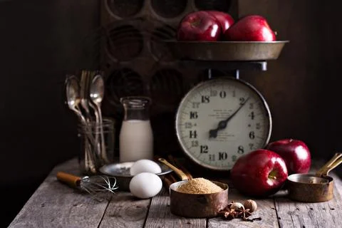 Baking with apples ingredients on rustic table Stock Photos