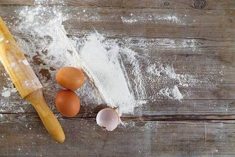 Baking background Baking background with eggs, eggshells, flour and rollin... Stock Photos