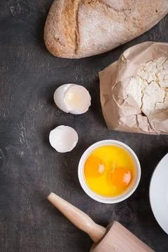  Baking background with bread, eggshell, flour, rolling pin Baking backgro... Stock Photos