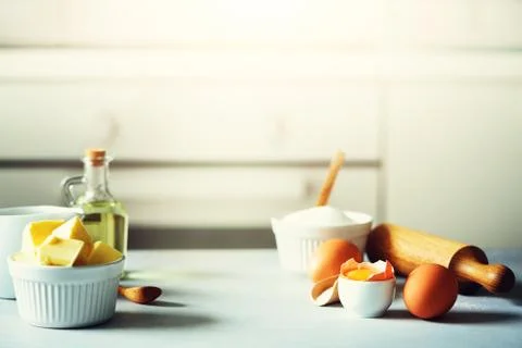 Baking background. Cooking ingredients for dough, eggs, flour, sugar, butter Stock Photos