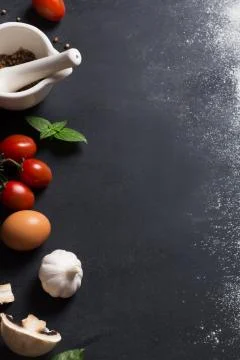 Baking background with copy space and vegetables on black surface for your te Fotos de archivo