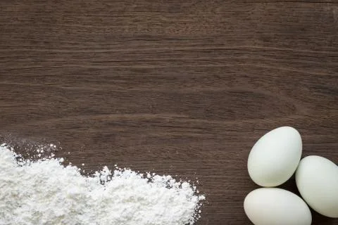 Baking background, eggs and flour on desk Stock Photos