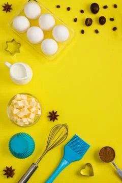 Baking background eggs butter milk spices kitchen tools Stock Photos