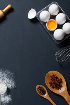 Baking background with eggs, floor and kitchen tools Stock Photos