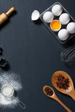 Baking background with eggs, floor and kitchen tools Stock Photos