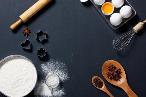Baking background with eggs, floor and kitchen tools Stock Photos