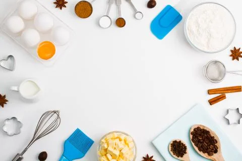 Baking background eggs flour milk spices kitchen tools Stock Photos