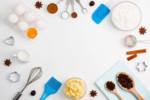 Baking background eggs flour milk spices kitchen tools Stock Photos