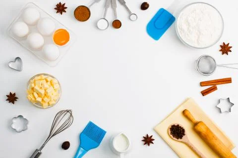 Baking background eggs flour milk spices kitchen tools Stock Photos