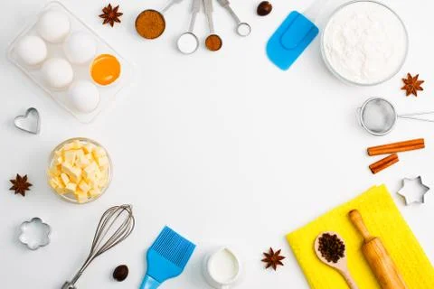 Baking background eggs flour milk spices kitchen tools Stock Photos