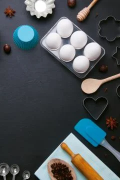 Baking background eggs kitchen tools shape cookie cutters Stock Photos