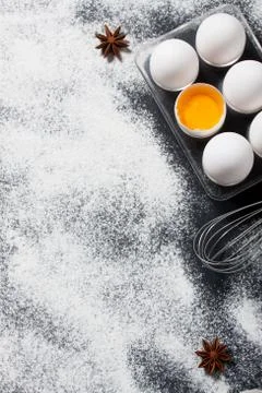 Baking background with eggs, whisk and star anise Stock Photos