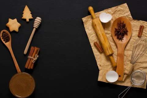 Baking background with kitchen tools and cookies on dark wood Stock Photos