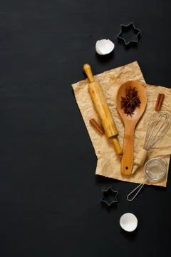 Baking background with kitchen tools on dark wood Stock Photos