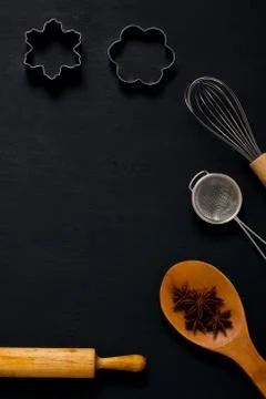 Baking background with kitchen tools on dark wood Stock Photos