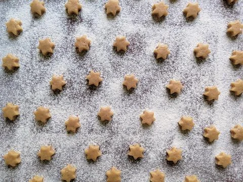 Baking background or pattern with raw coocies srars, flour Stock Photos