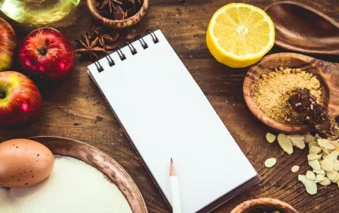 Baking background with paper for notes. Christmas and winter  cookies ingredi Stock Photos