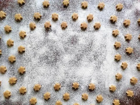 Baking background with raw coocies srars, flour and white place for text Stock Photos