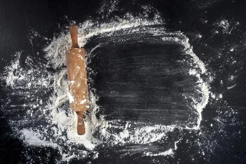 Baking background with white flour and a rolling pin, overhead shot with a place Stock Photos