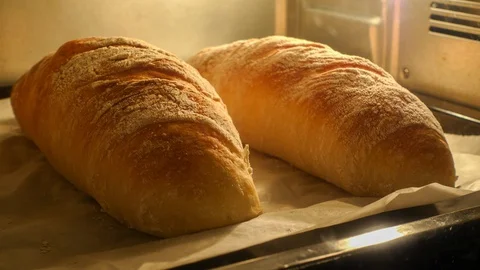 Baking Baguette in Oven Time-lapse Shot, Rising in Tray with Temperature. Stock Footage