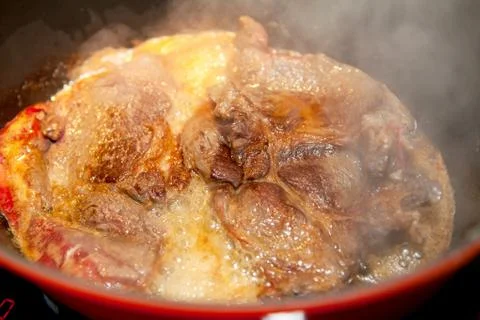 Baking beef in saucepan Stock Photos