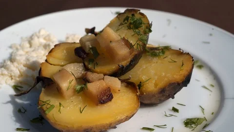 Baking botatoes bnd bacon In The oven with white cheese. 4k Stock Footage 104060952