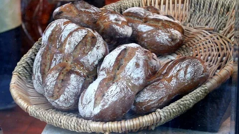 Baking bread. Bakery. Shelves with fresh baked crispy bread. Stock Footage 100940291