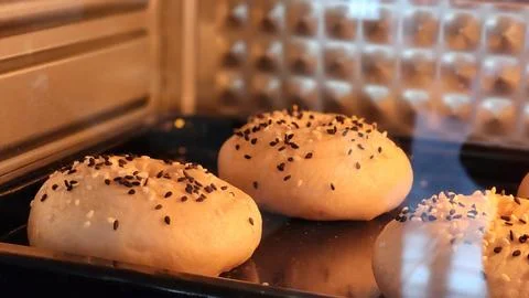 Baking Bread: Close-up of Sesame Seed Rolls in Oven Stock Photos