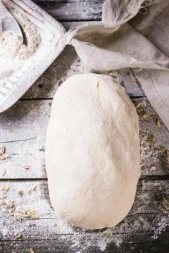 Baking bread. Dough on wooden table with flour. Top view. See series Stock Photos