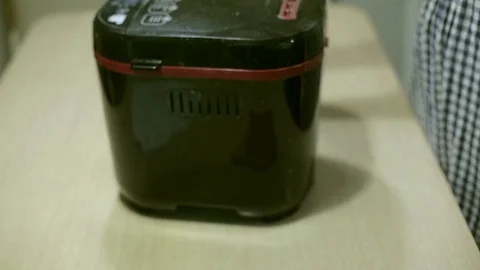 Baking bread at home in a Bread Machine Stock Footage 103567923