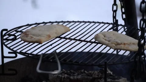 Baking bread outsine during winter Stock Footage